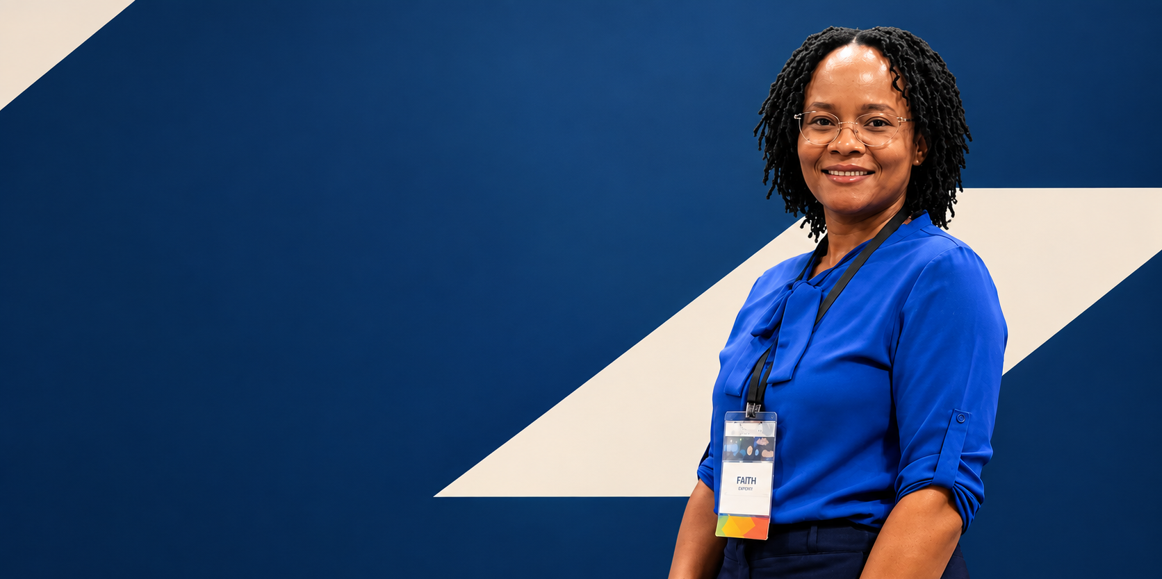 Dr. Faith, career mentor, smiling at her desk in a modern office